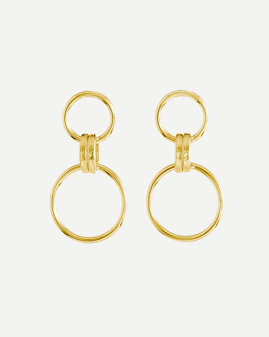 Bold gold drop earrings made from large and small textured loops on white background