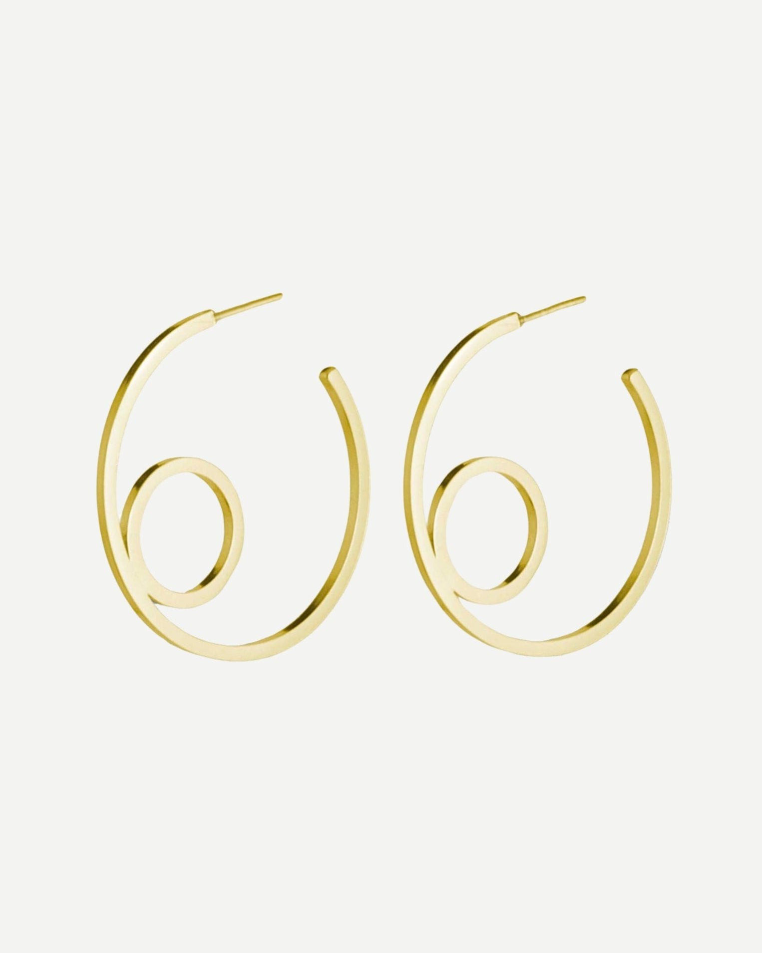 Large gold hoop earrings with minimalist circle design on white background