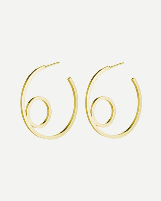 Large gold hoop earrings with minimalist circle design on white background