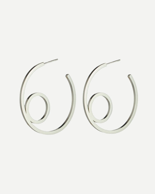 Large sterling silver hoop earrings with circle design on white background