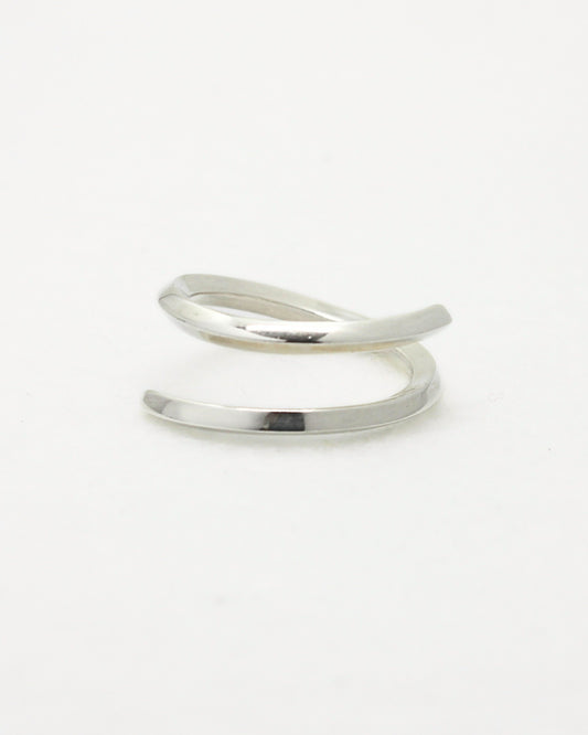 Thin sterling silver adjustable ring made from square wire on white background