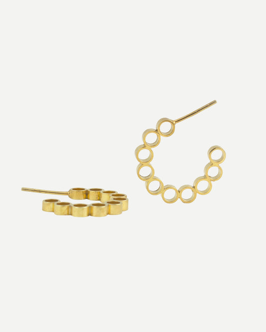 Front and side views of gold hoop earrings with circle design on white background