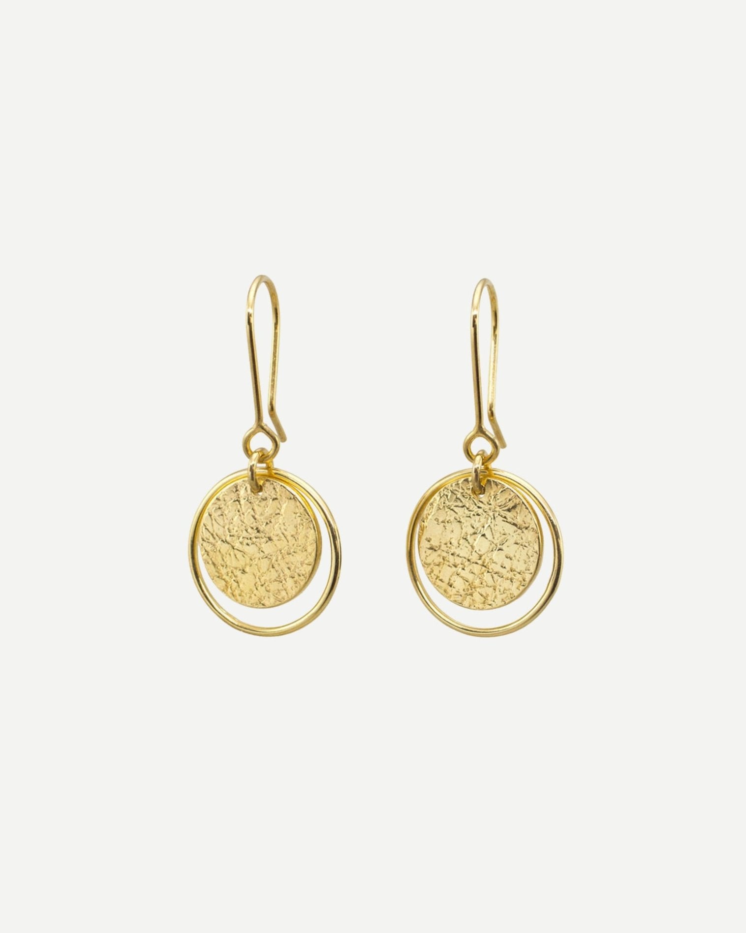 Elegant gold earrings consisting of textured circles framed by thin loops hanging from handmade gold hooks