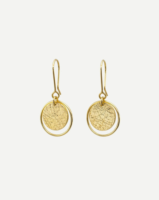 Elegant gold earrings consisting of textured circles framed by thin loops hanging from handmade gold hooks