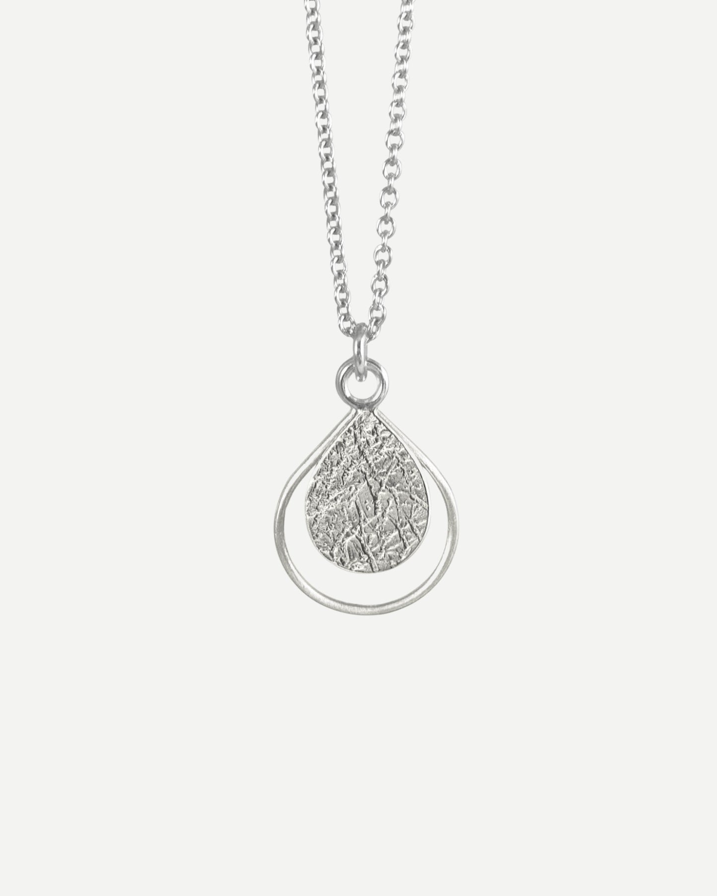 artisan textured sterling silver dewdrop pendant by aurelium nz
