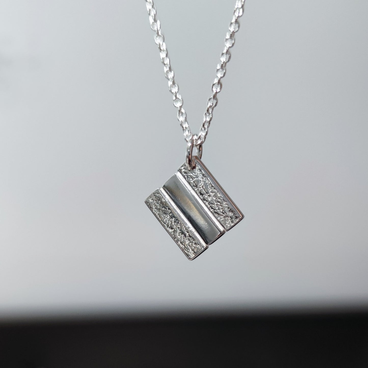 handmade textured sterling silver stack pendant