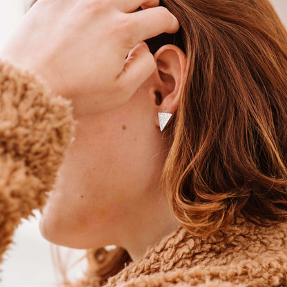 model wearing minimalist sterling silver textured triangle studs