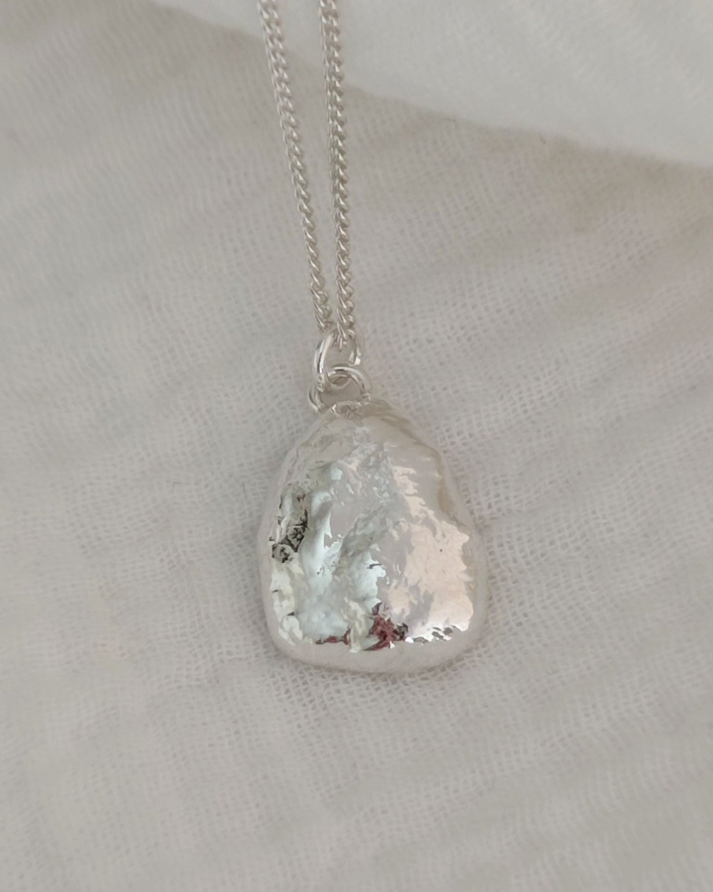 organic polished sterling silver necklace with textured surface
