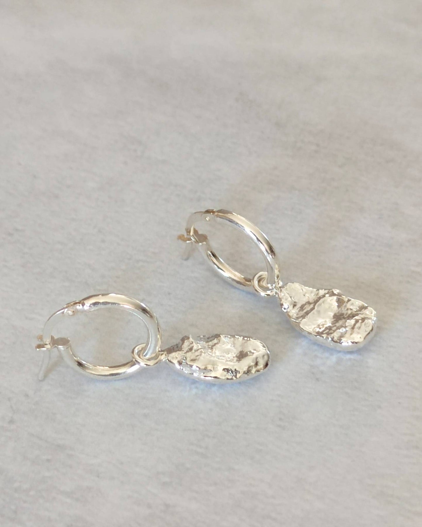 timeless molten silver freeform droplet earrings on creole hoops