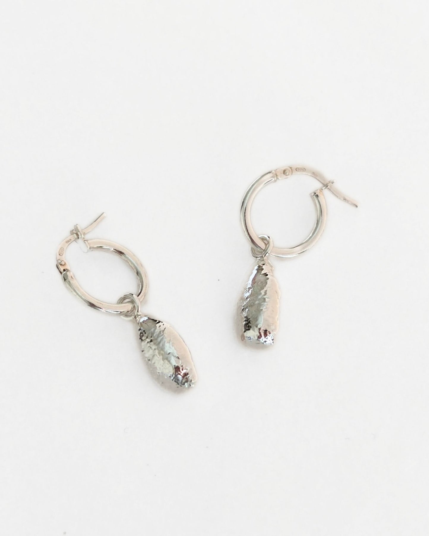 organic molten sterling silver droplet earrings on creole hoops