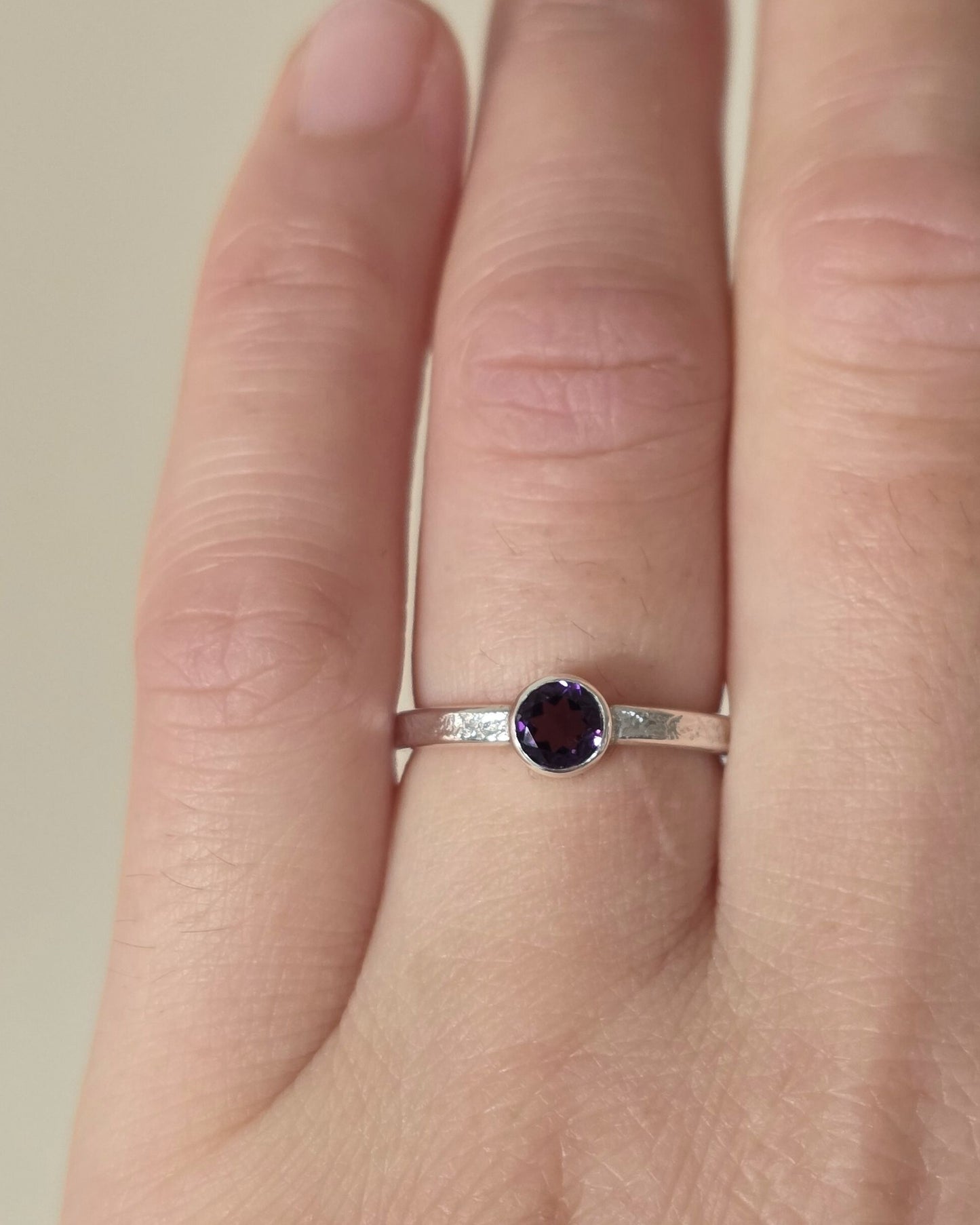 model wearing handcrafted sterling silver amethyst textured ring