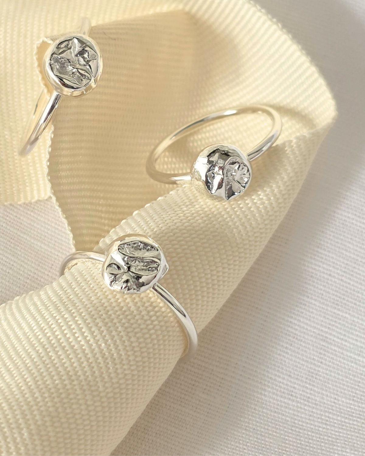 Organic sterling silver textured molten nuggets on delicate silver ring band