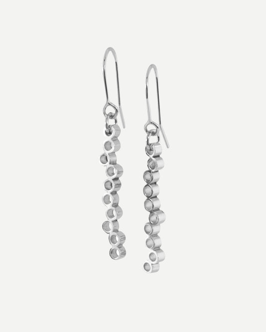 Long sterling silver dangly earrings with circle design hanging from silver hooks