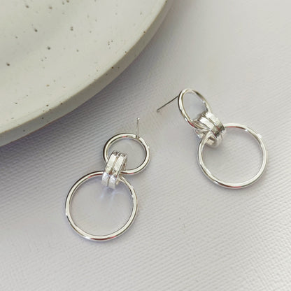 sterling silver link earrings by aurelium on cream background