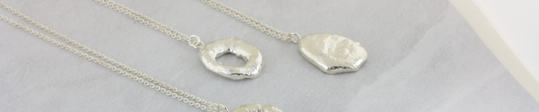 handmade silver freeform molten necklaces by aurelium nz