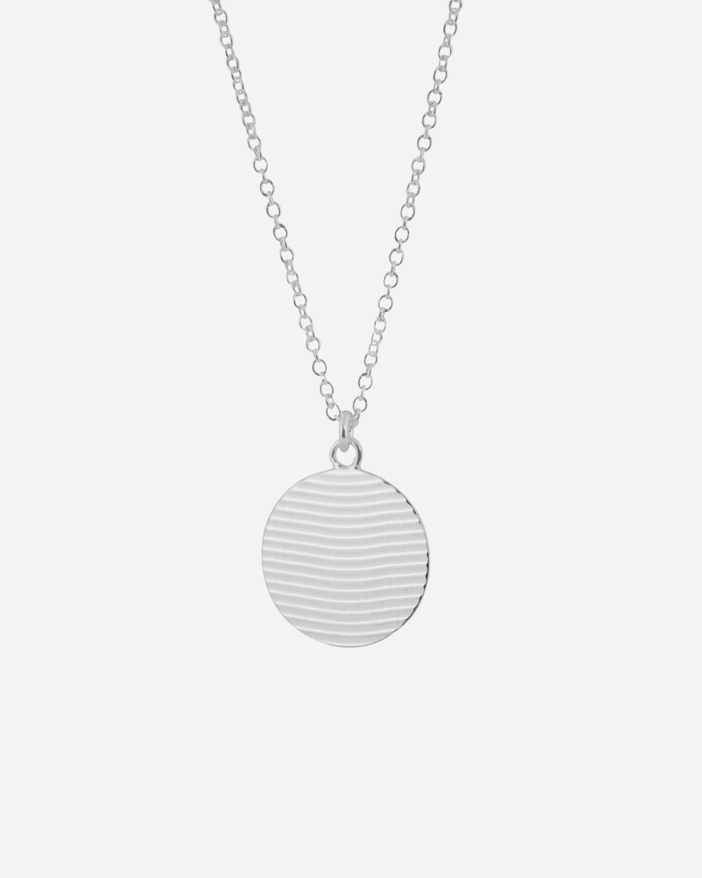 delicate textured sterling silver ripple circle pendant by aurelium nz