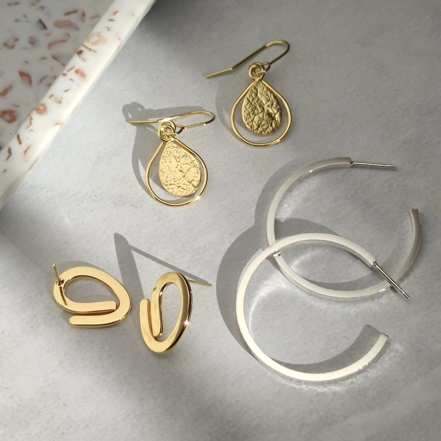 elegant textured gold and silver earrings by aurelium nz