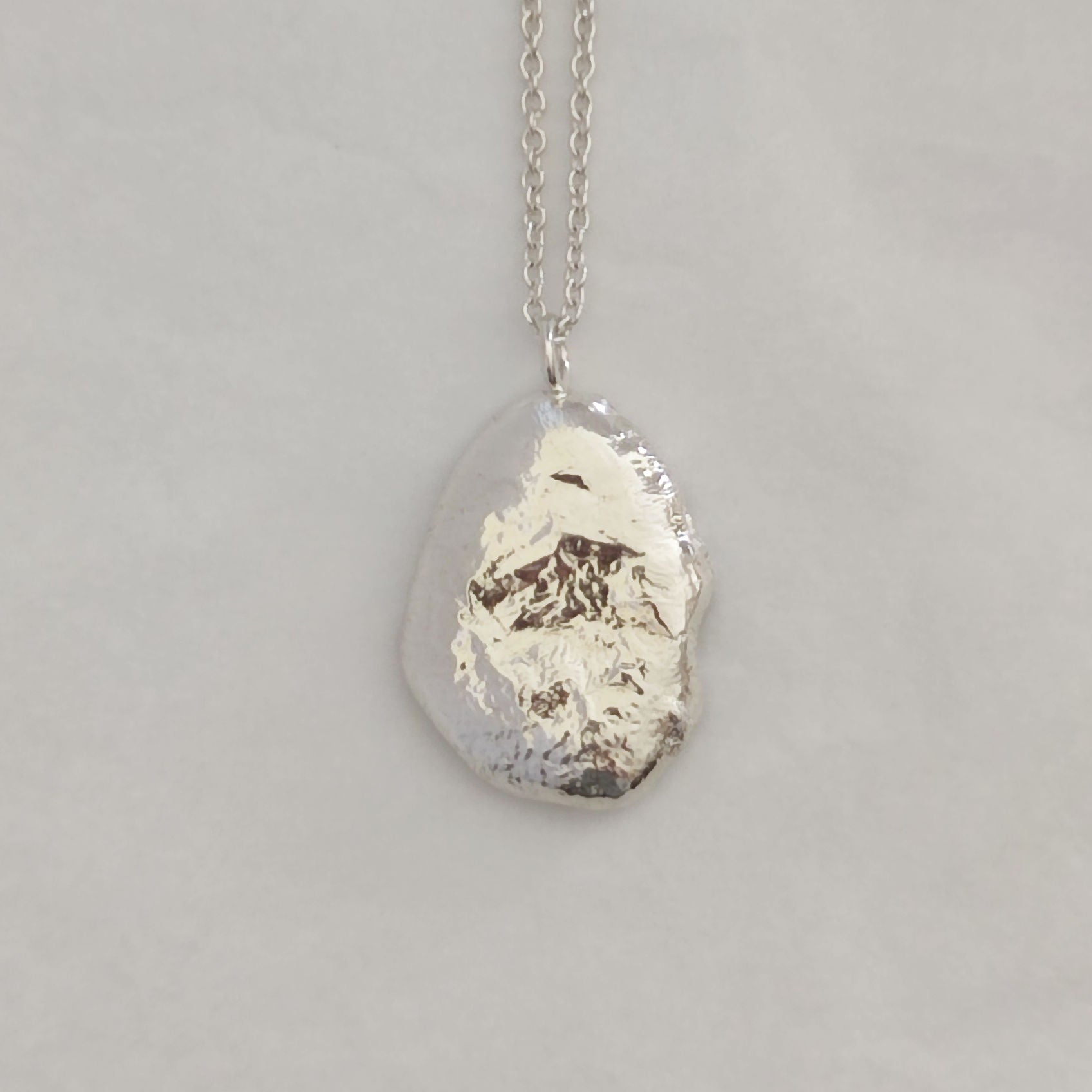 organic textured sterling silver molten pebble necklace
