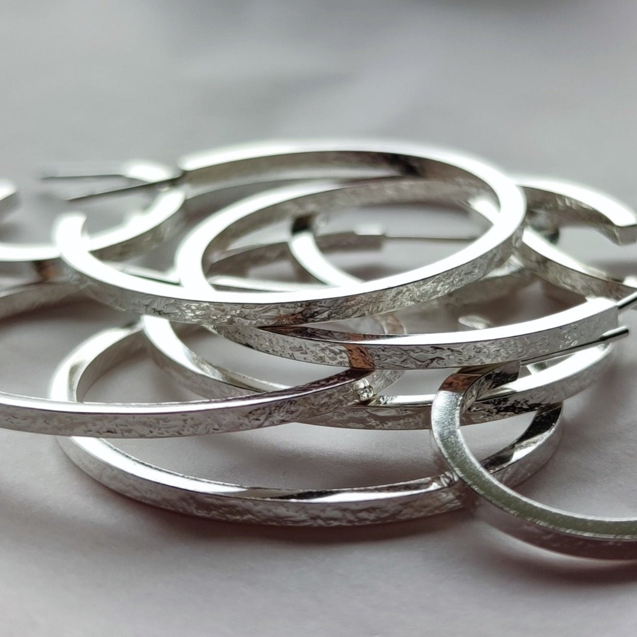 minimalist silver small texture hoop earrings with intricate detailing