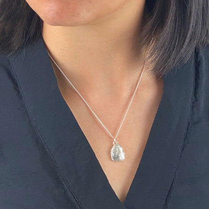 model wearing small molten sterling silver pendant by aurelium