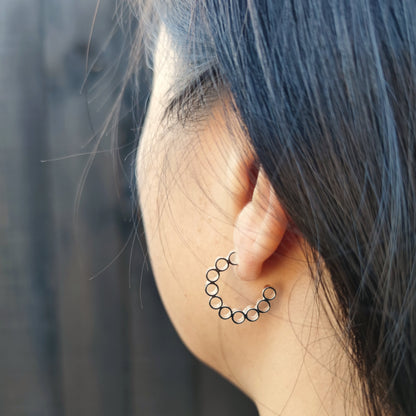 model wearing minimalist sterling silver elements hoop earrings