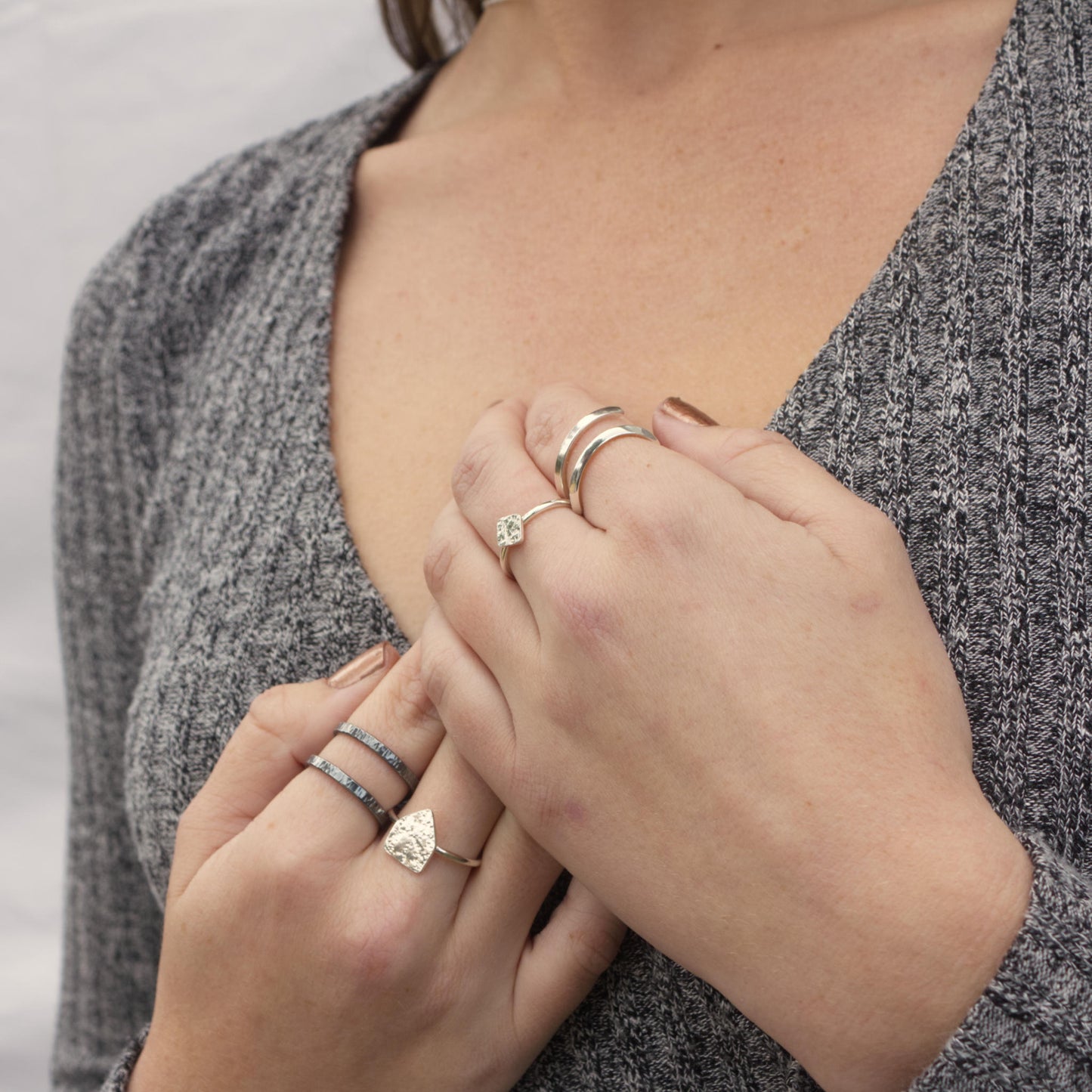 model wearing minimalist adjustable silver flicker ring