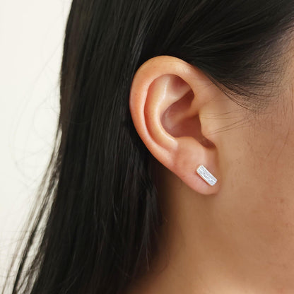 model wearing minimalist textured bar studs handmade in nz