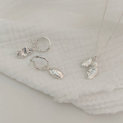 delicate sterling silver molten drop pendant and earrings by aurelium