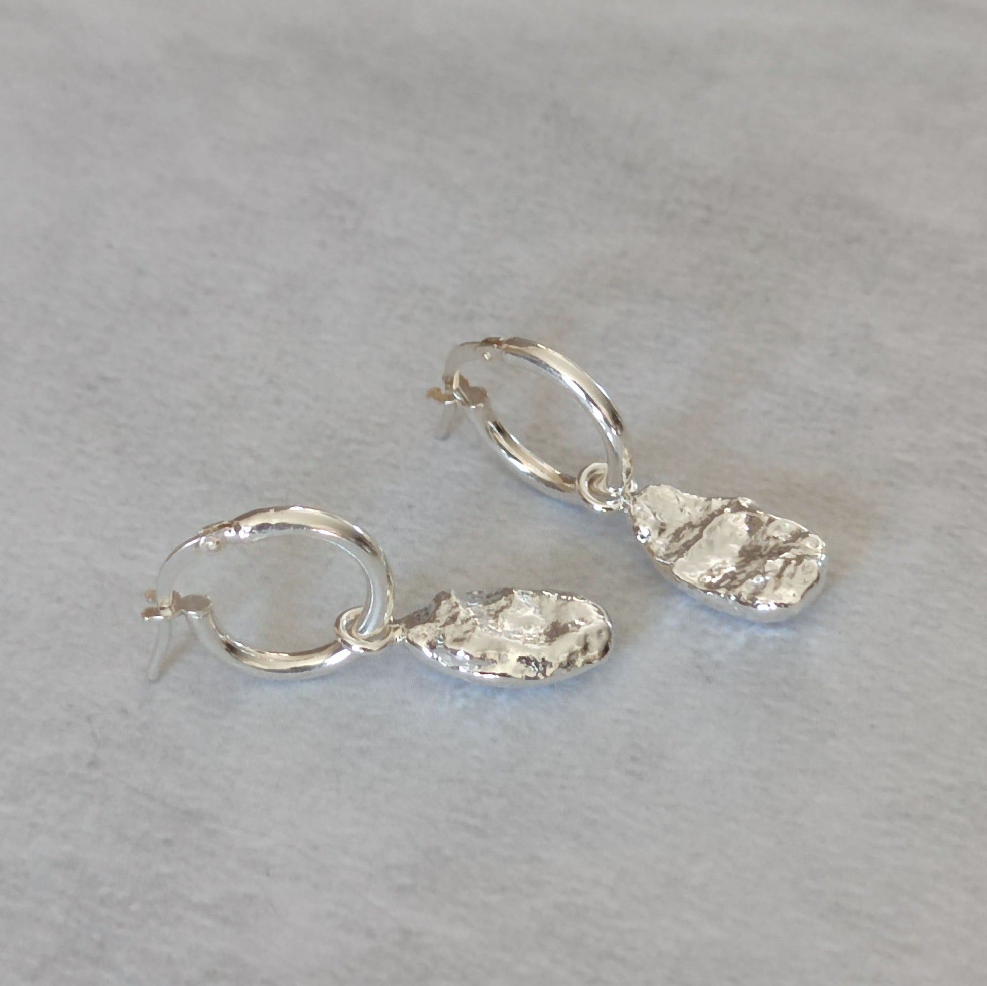 organic textured molten drop charms on silver hoops