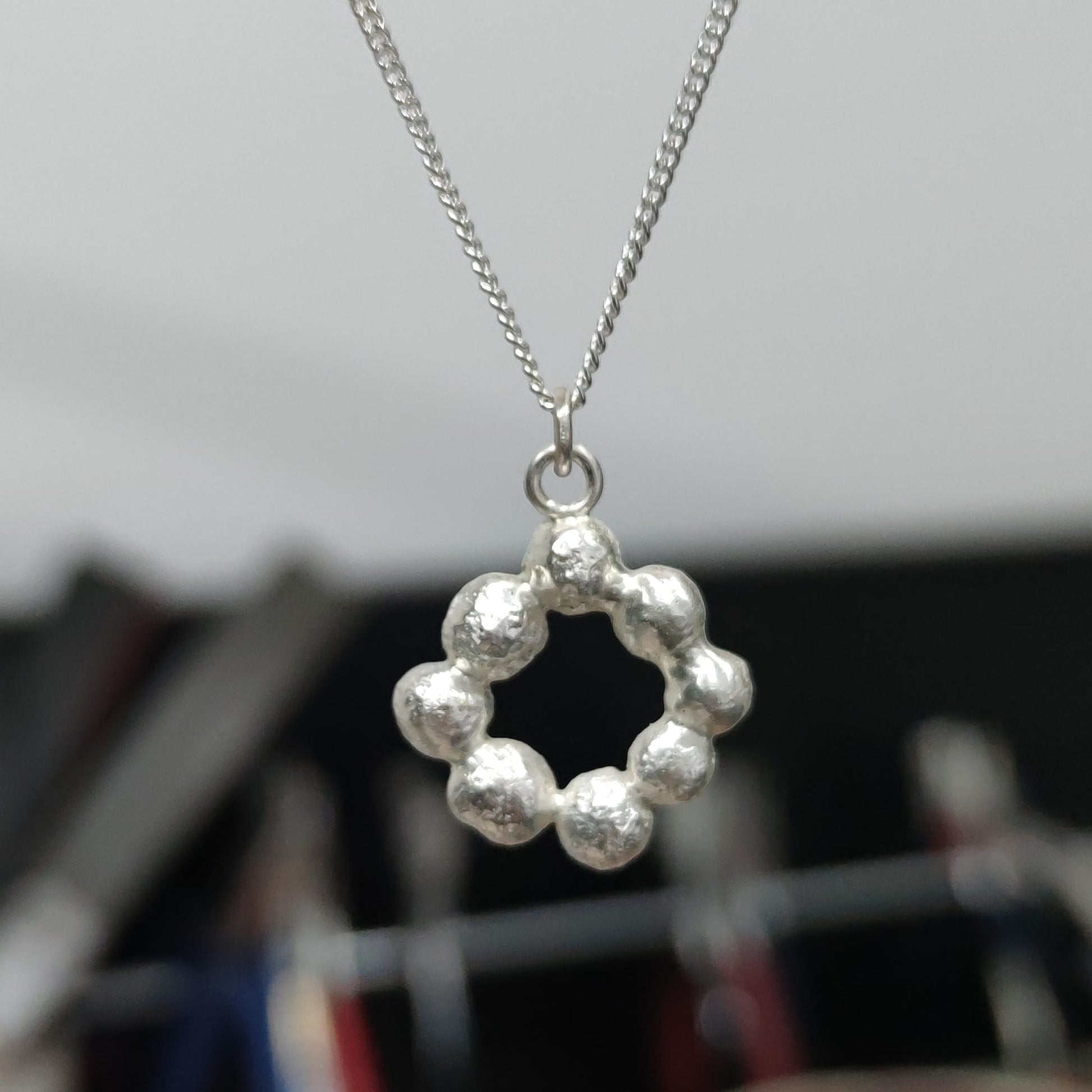 elegant molten silver linked bubble pendant on chain