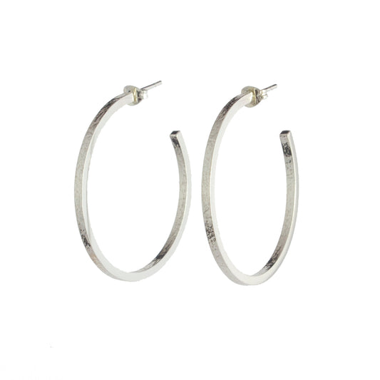 Large texture hoop earrings by aurelium on white background