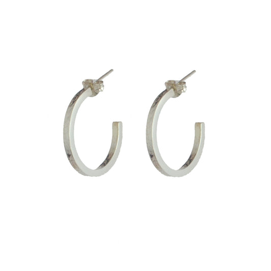 sterling silver texture hoop earrings by aurelium on white background