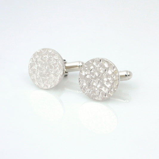 handmade sterling silver dimple cufflinks on white background