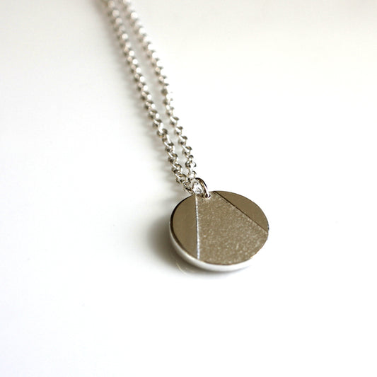 handmade sterling silver geo circle necklace by aurelium on white background