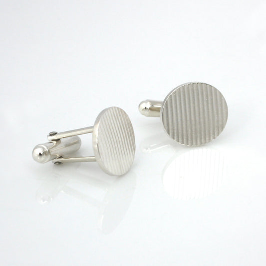 handmade sterling silver nine-to-five cufflinks on white background