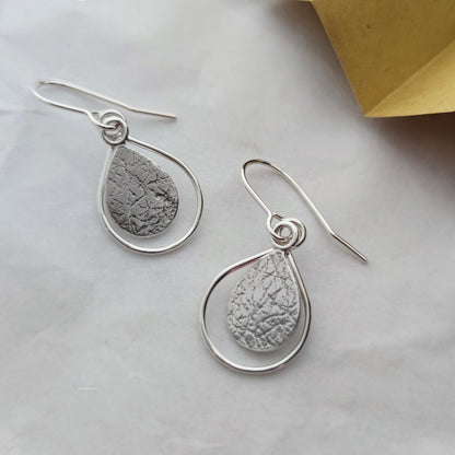 sterling silver dewdrop drop earrings by aurelium on marble surface