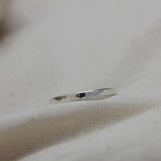 delicate handmade silver stacking ring with hammered texture